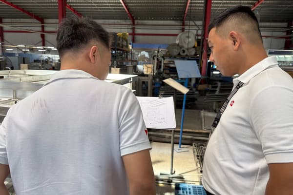 DEWIN team reviewing drawings during an on-site supplier audit in Vietnam