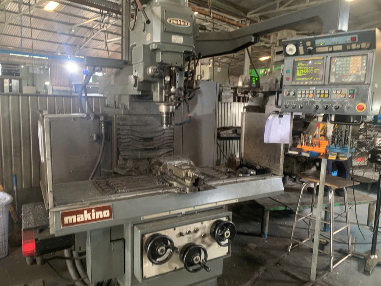 CNC vertical machining center at a Vietnam precision factory producing stainless steel parts