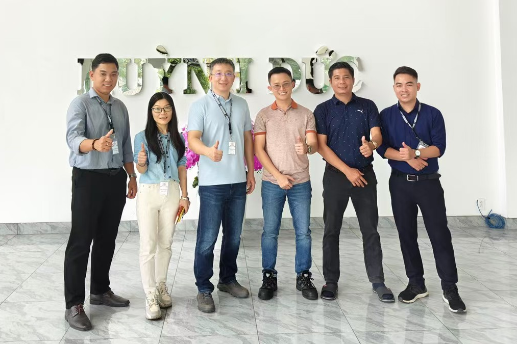DEWIN team and a customer at an audited factory in Vietnam